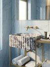 Hand-carved fluted vessel sink profile for a custom marble bathroom sink