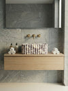 Calacatta viola fluted marble vessel sink shown for a made-to-order vanity project