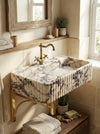 Premium bathroom styling with a natural stone metal stand sink